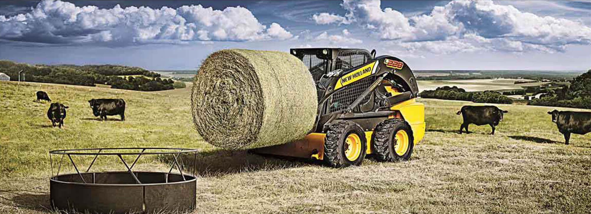 New Holland skid with bale